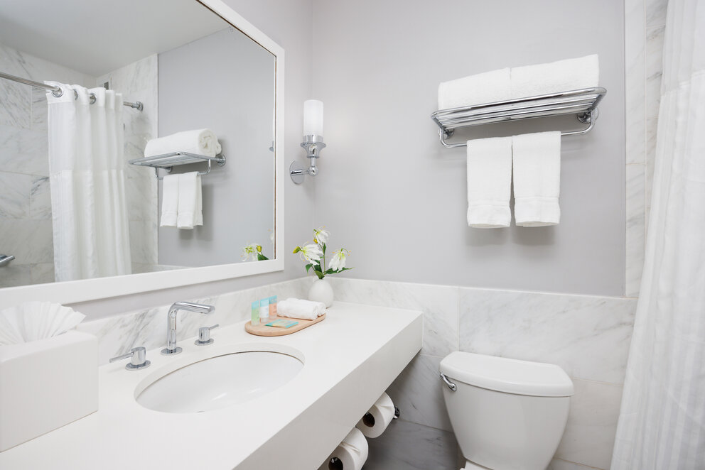 a bathroom with a mirror and sink