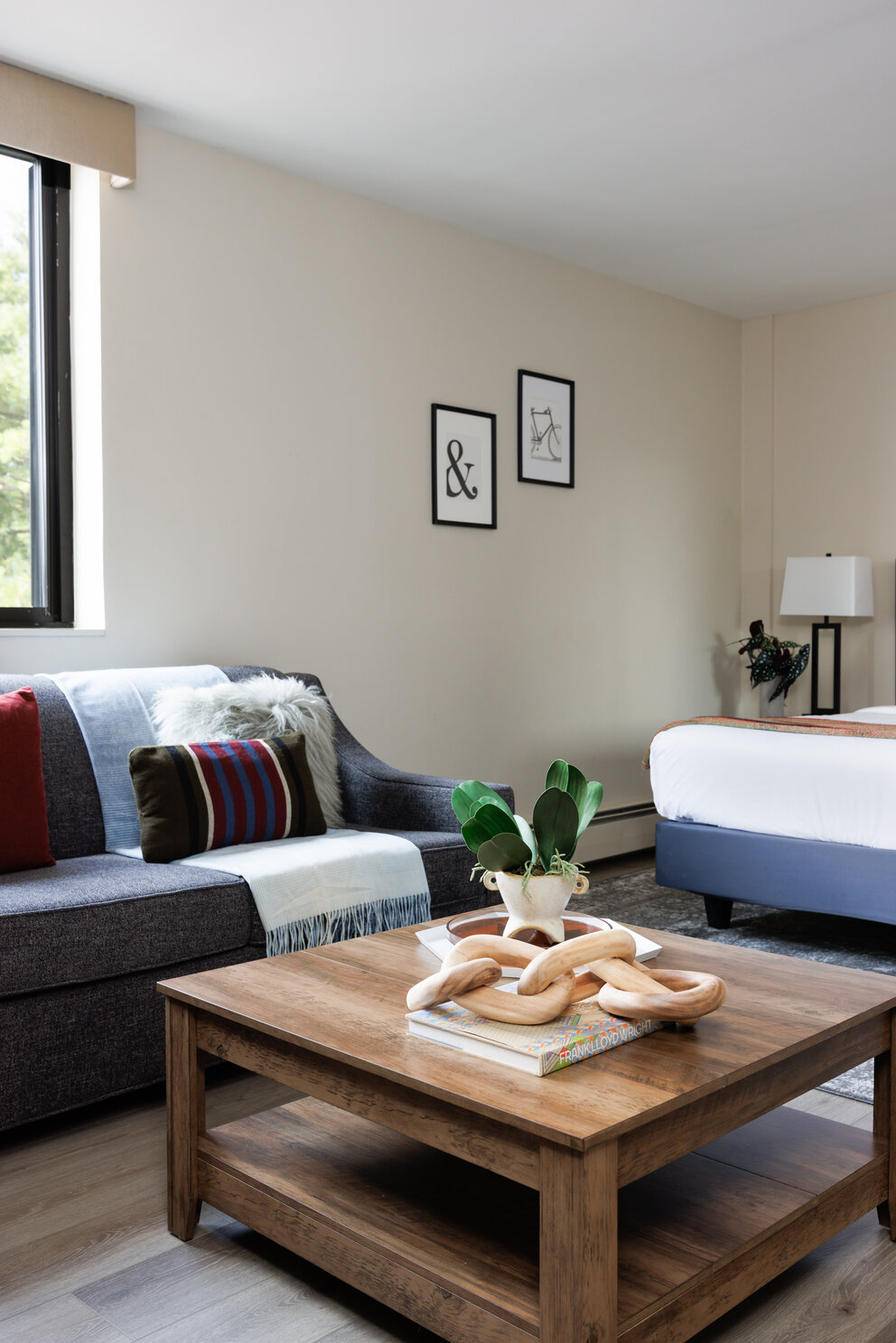 a room with couches and a table with a bagel on it