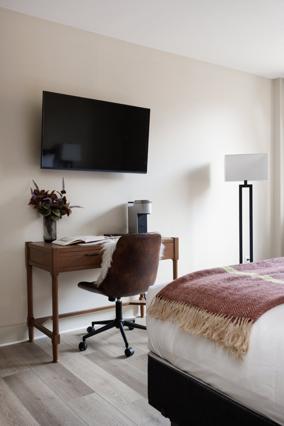 a desk and chair in a hotel room