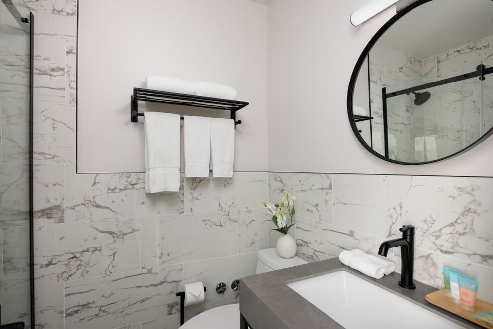 a bathroom with a mirror and sink