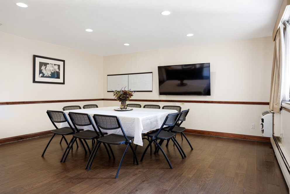 a room with a table and chairs